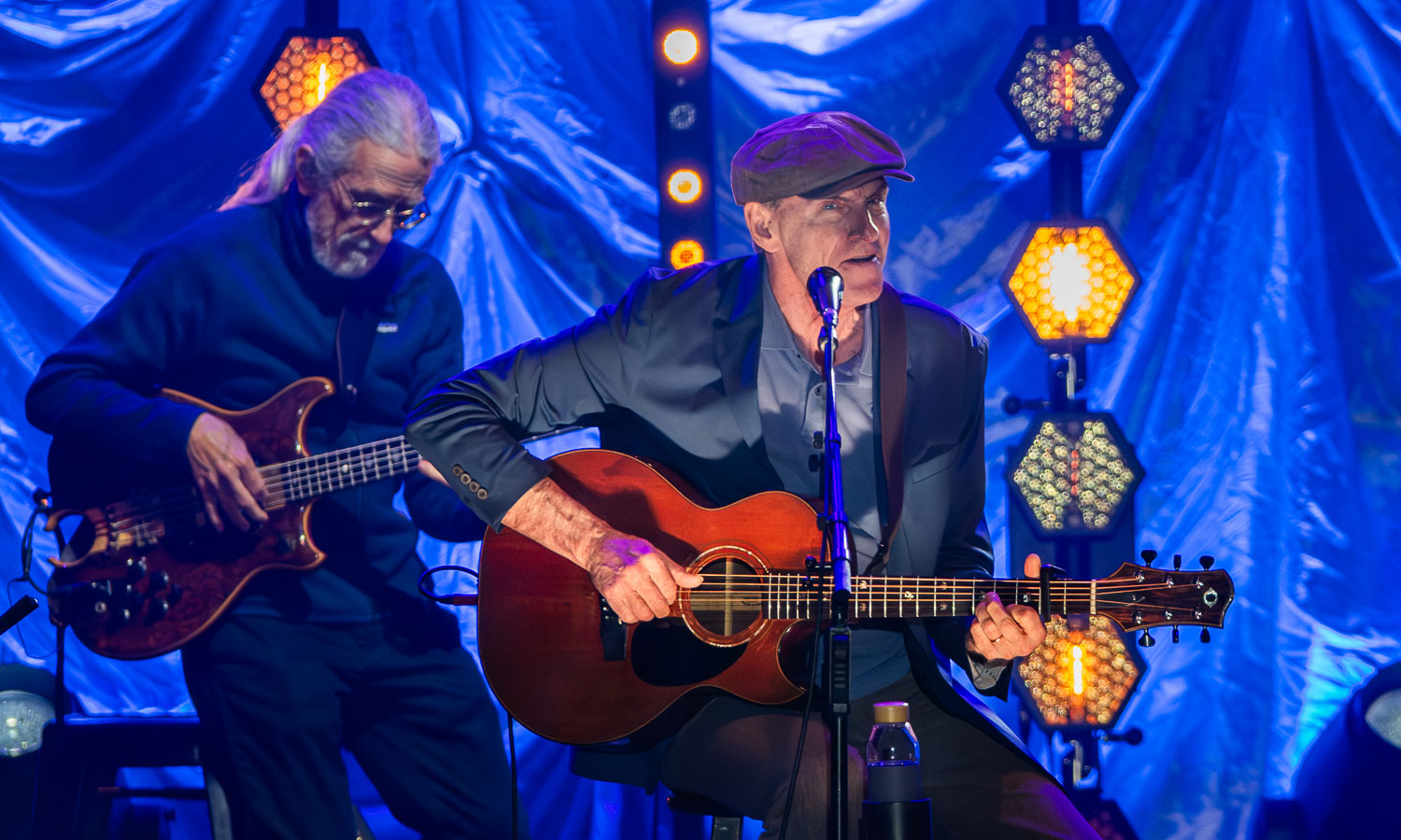 James Taylor performing live on stage during his 2025 tour